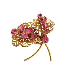 Sparkle and Shine with our Gold Tone Flower Brooch!